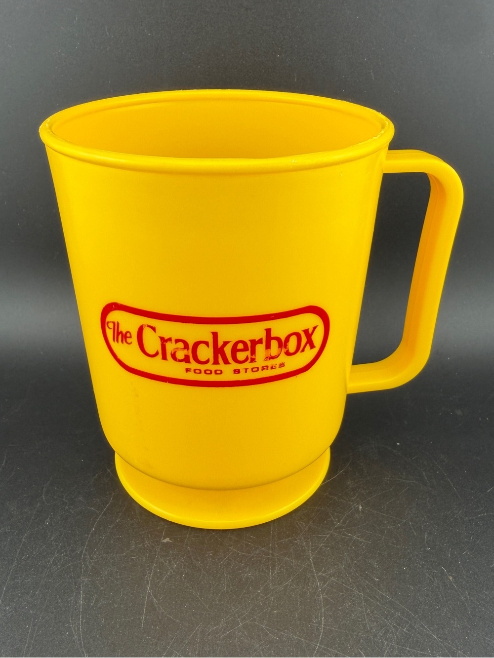 Vintage The Crackerbox Food Stores Yellow Plastic Footed Mug Arkansas Petroliana